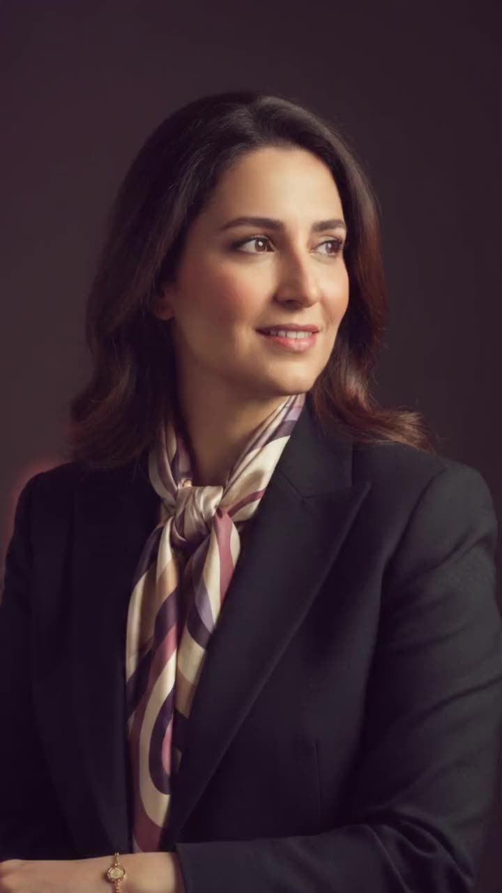 Dalia in the studio after the late show, silk scarf at her collar
